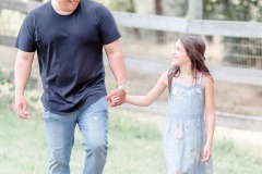 father-daughter-smiling-walking
